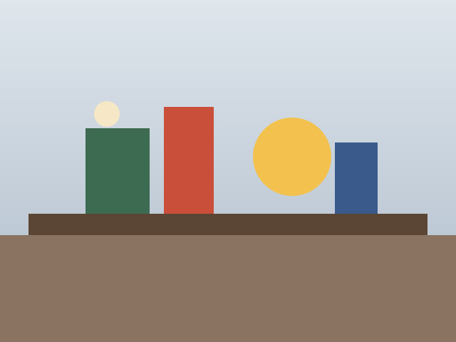 A flat illustration of four coloured blocks on a table against a pale sky